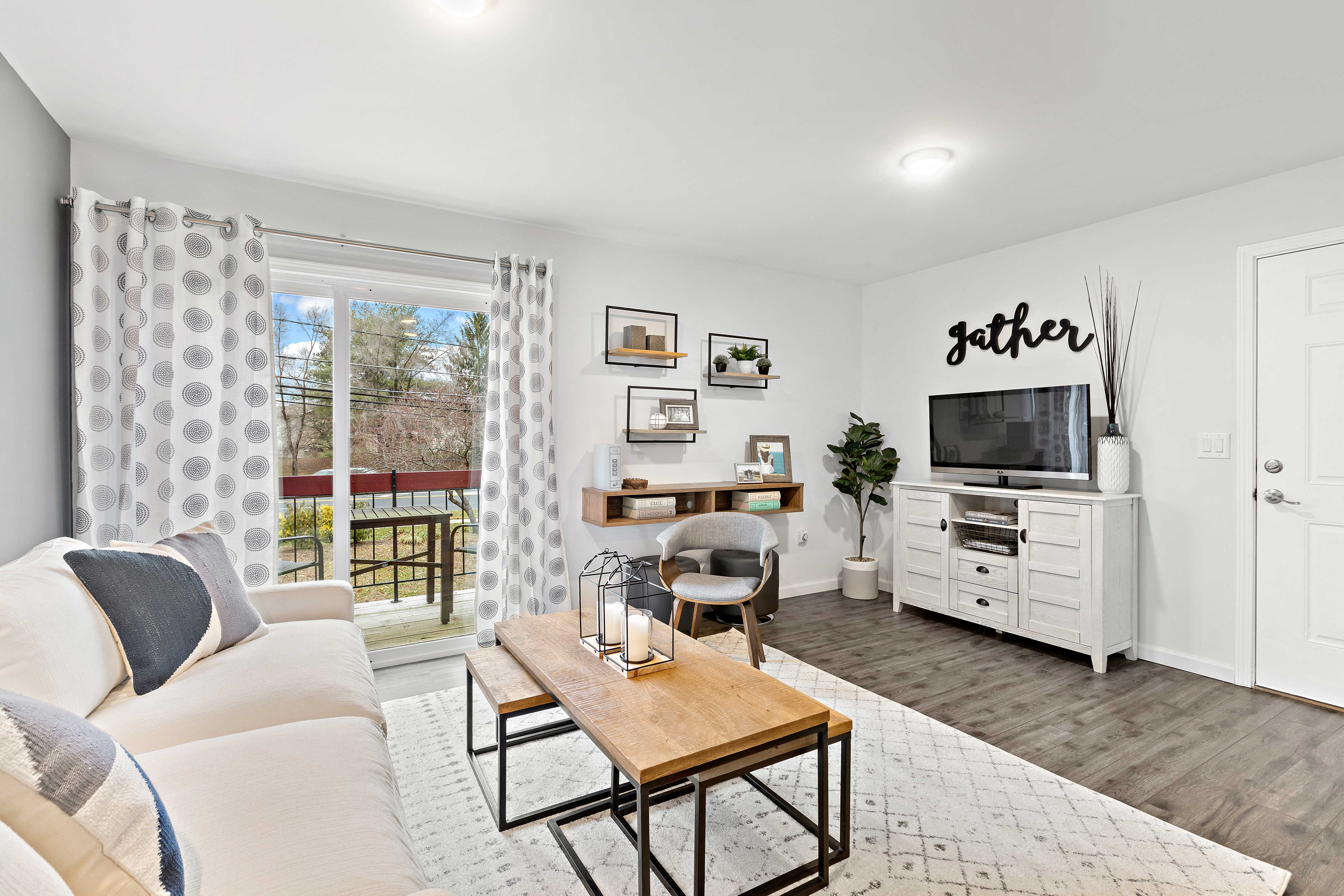 a living room with a couch and a tv