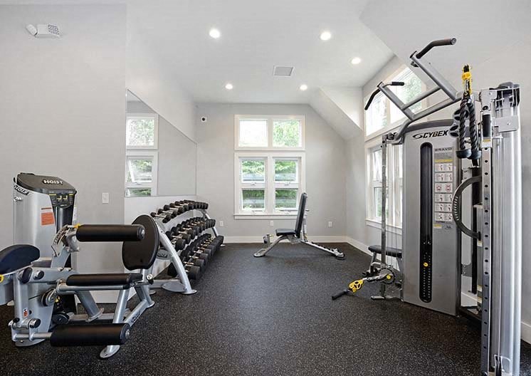 a gym with weights and other equipment in it