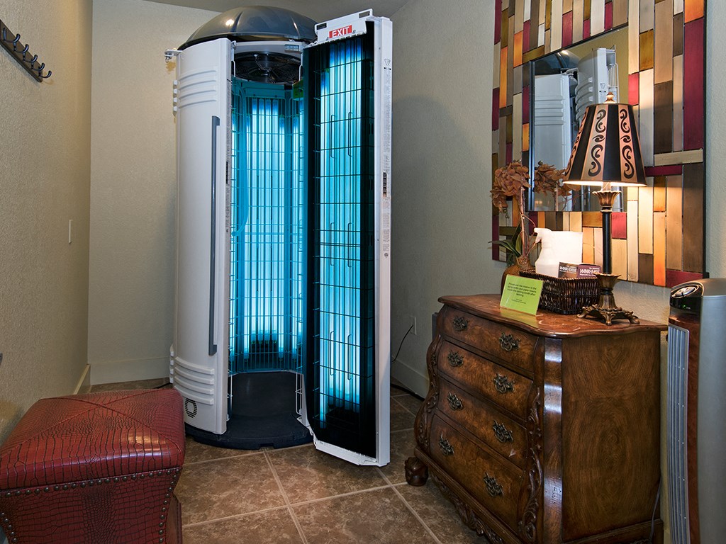 a room with a heater and a dresser