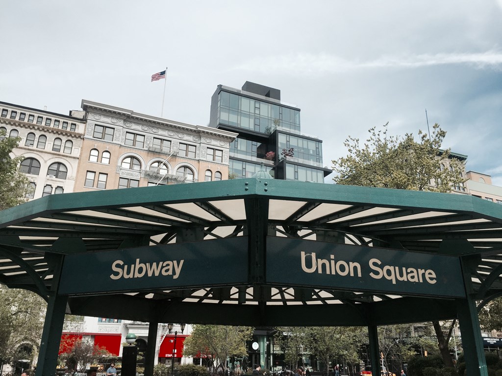 the subway station at union square in front of a large building