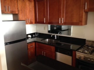 a kitchen with a stove and a refrigerator