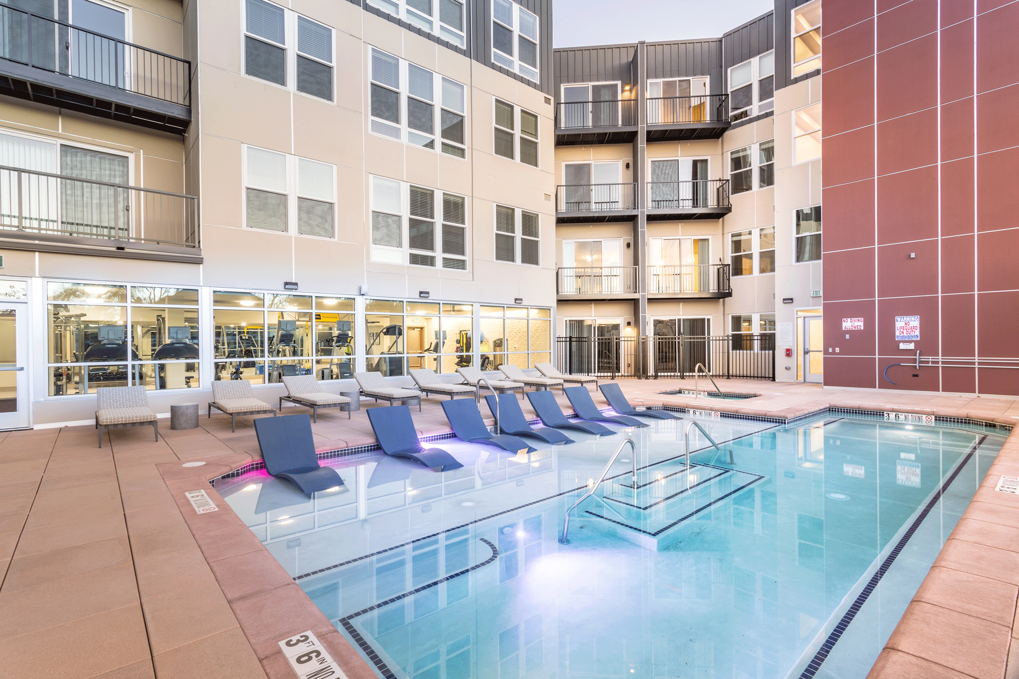 Pool with in-pool loungers at The York on City Park in Denver