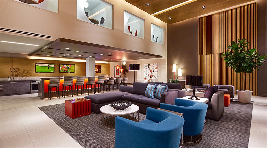 Resident lounge with kitchen, high-tech gaming room, e-business center and office pods