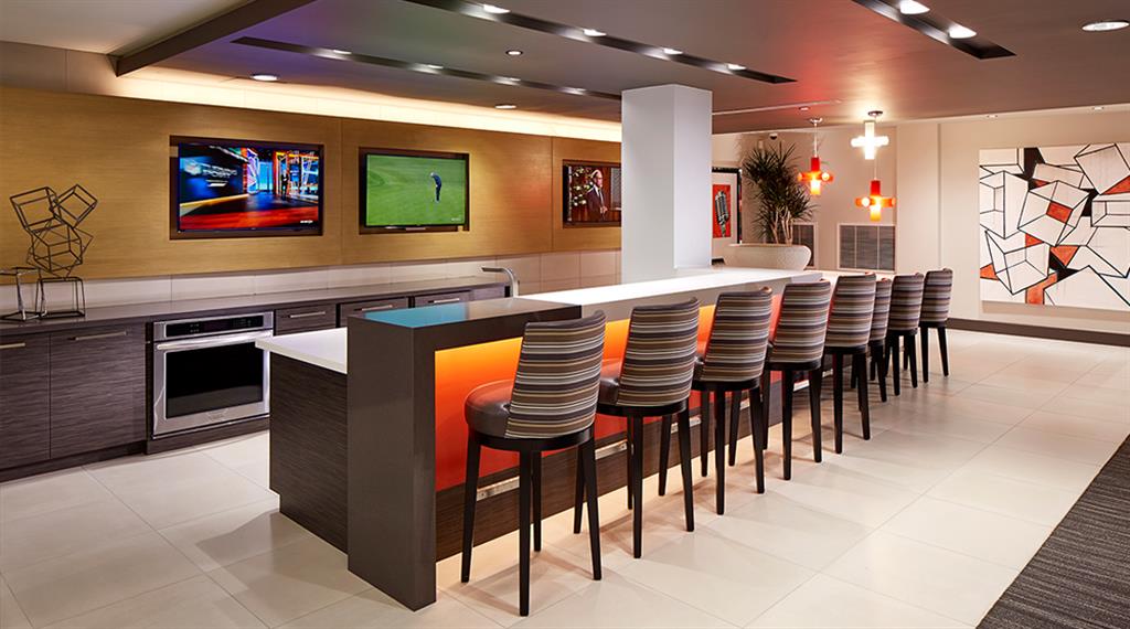 Resident lounge with kitchen, high-tech gaming room, e-business center and office pods