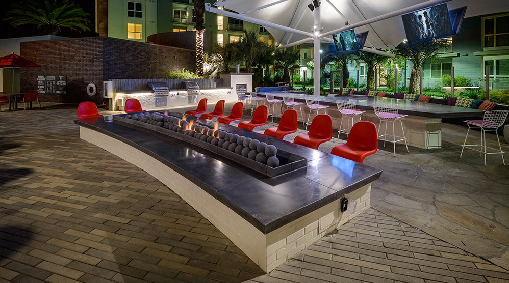 Incredible outdoor entertainment areas covered by a tensile structure with TV's