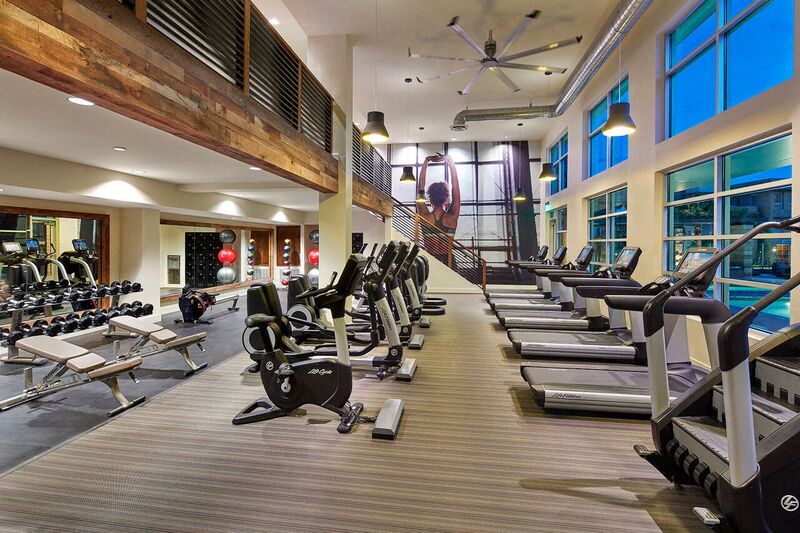 fitness and conditioning club with cardio and weight training equipment