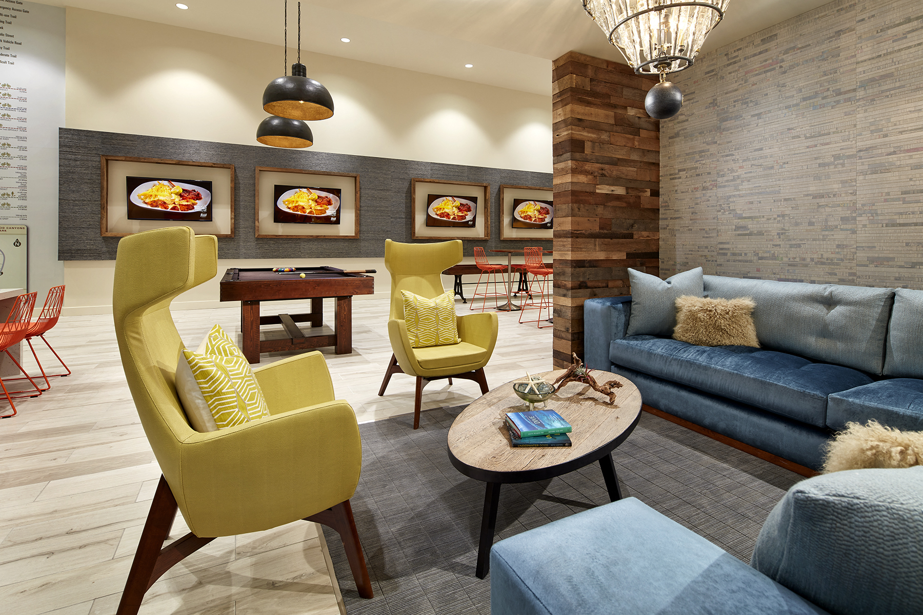 a living room with couches and chairs and a table