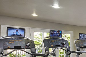 Woodbridge Apartments: Fitness Center Fitness center amenity with cardio machines at Woodbridge apartments in Irvine.