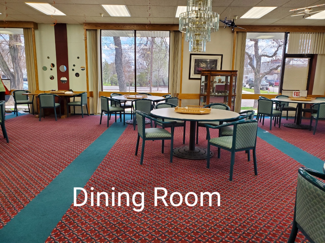 a dining room with tables and chairs and a chandelier