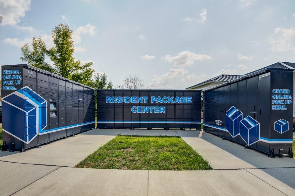 a large black building with a sign that reads refresh package center