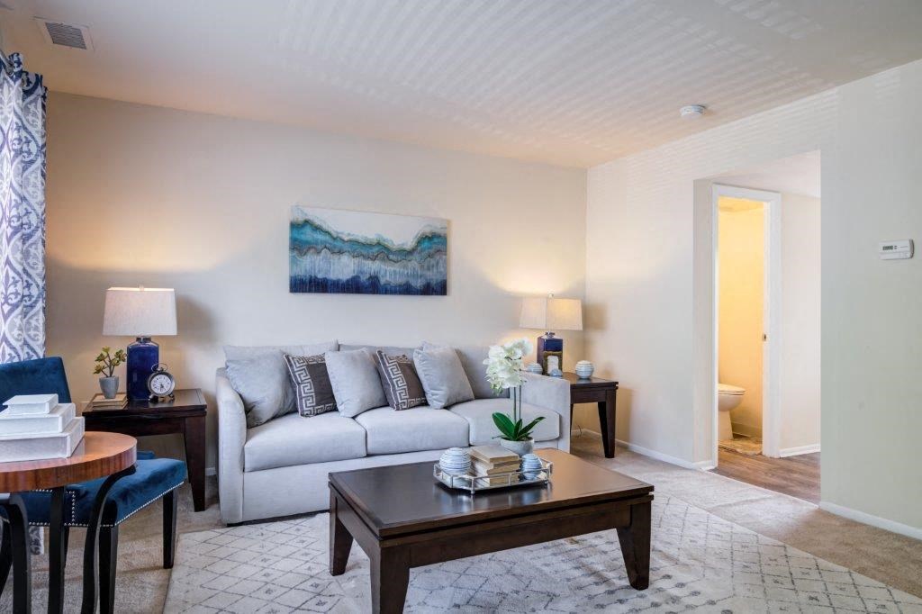 a living room with a couch and a table