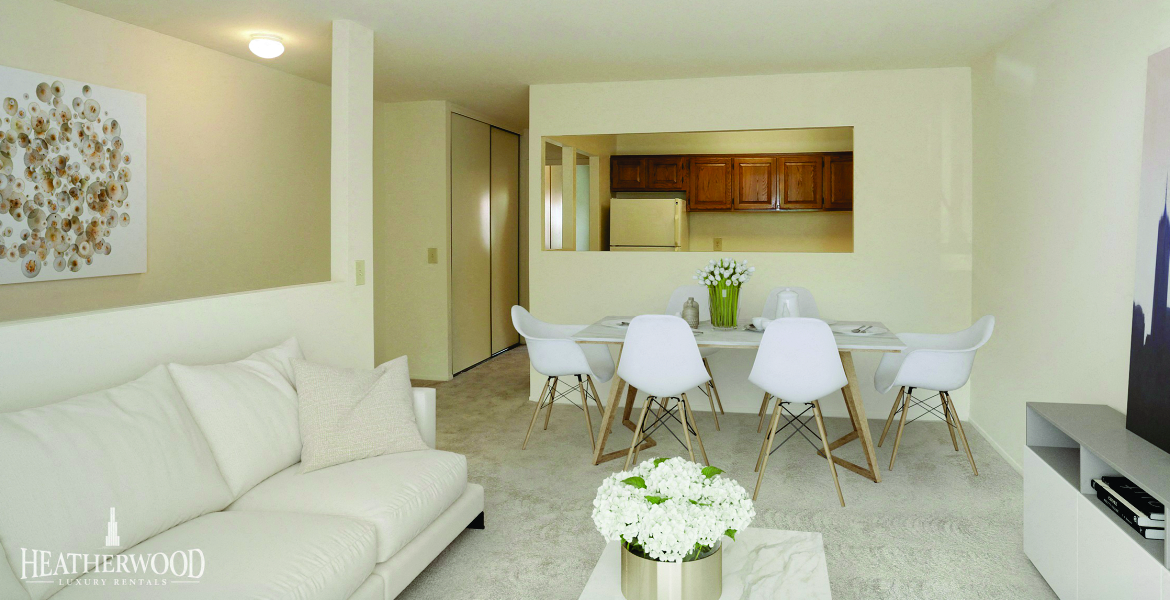 Living Room Set with Dining Table in Background at Southwood Luxury Apartments, North Amityville, New York