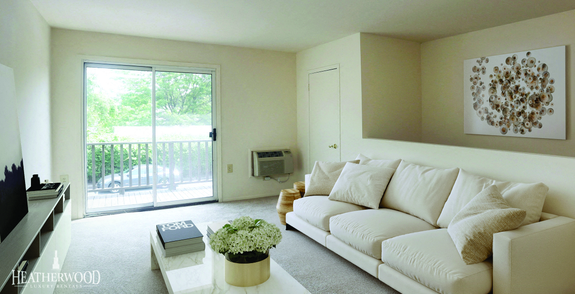 a white living room with a white couch and a television