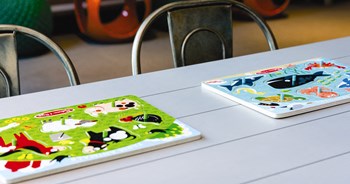 children's puzzles on playroom table at Tower 28, Long Island City, NY - Photo Gallery 14