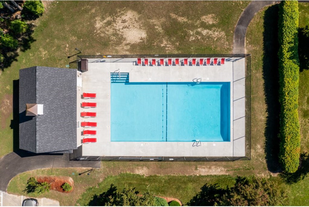 an overhead view of a swimming pool on the side of a building
