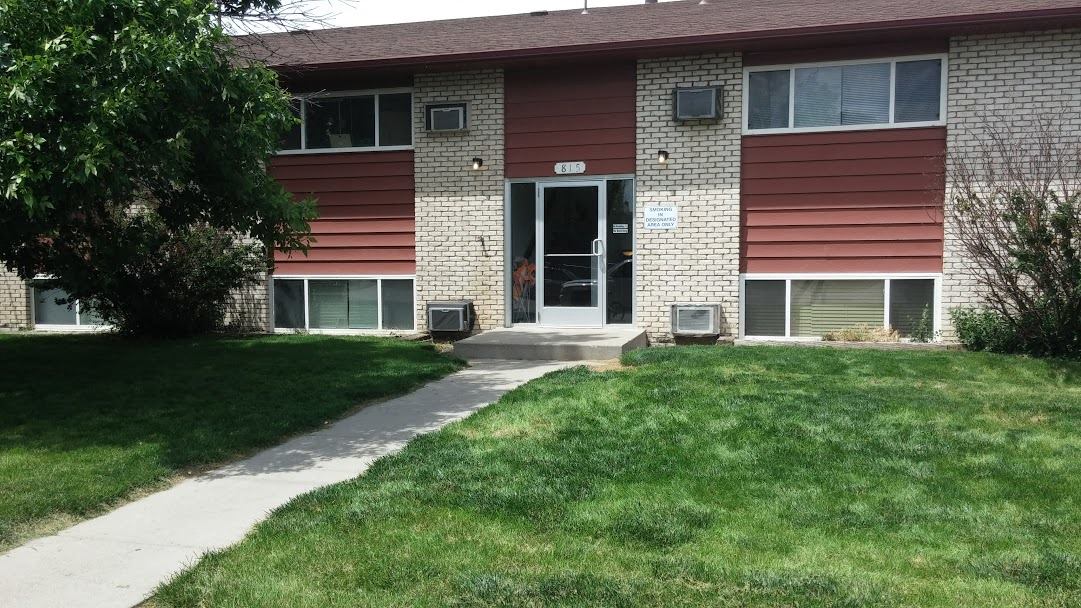 a house with a sidewalk in front of it
