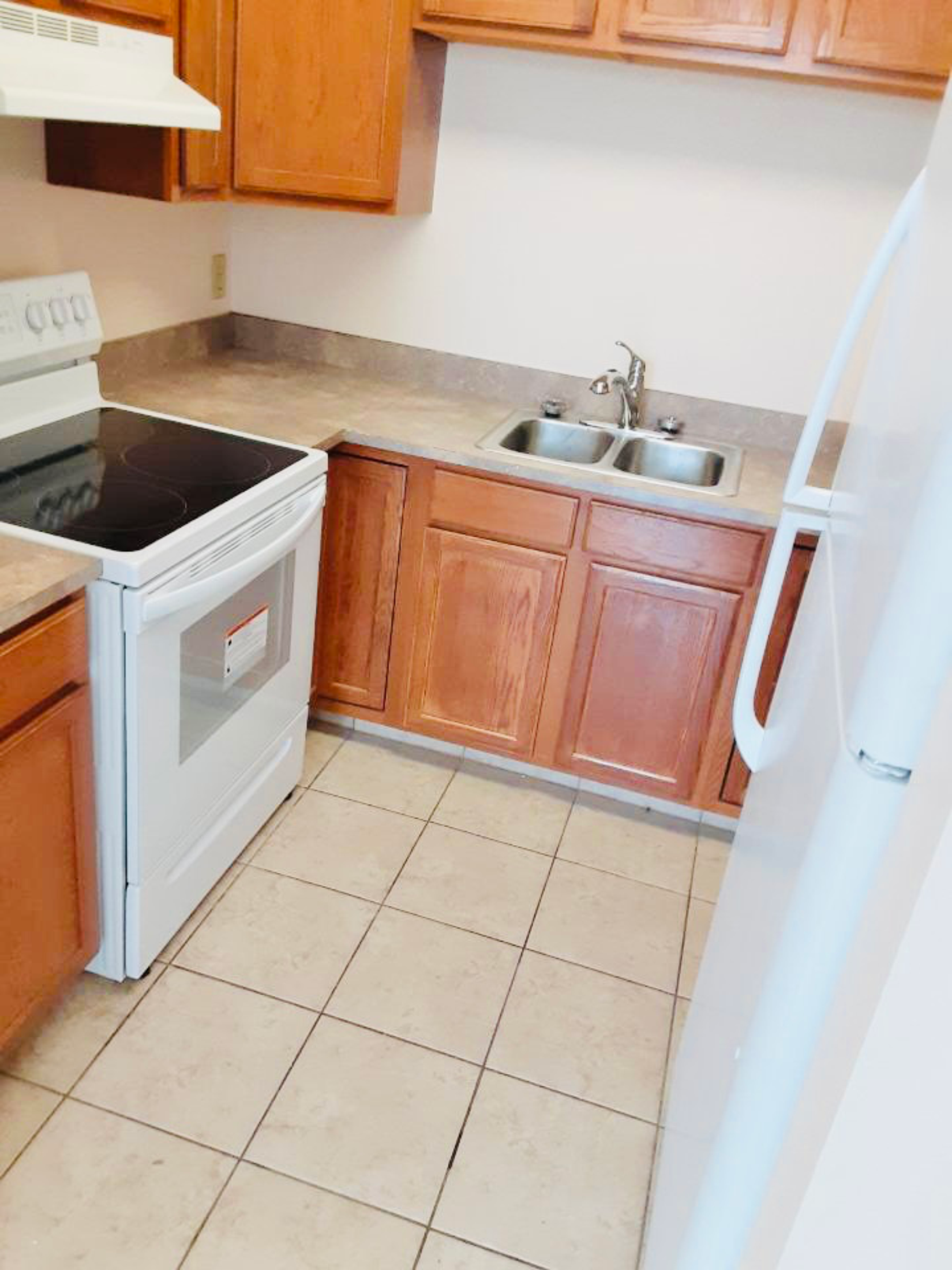 a small kitchen with a stove and a sink