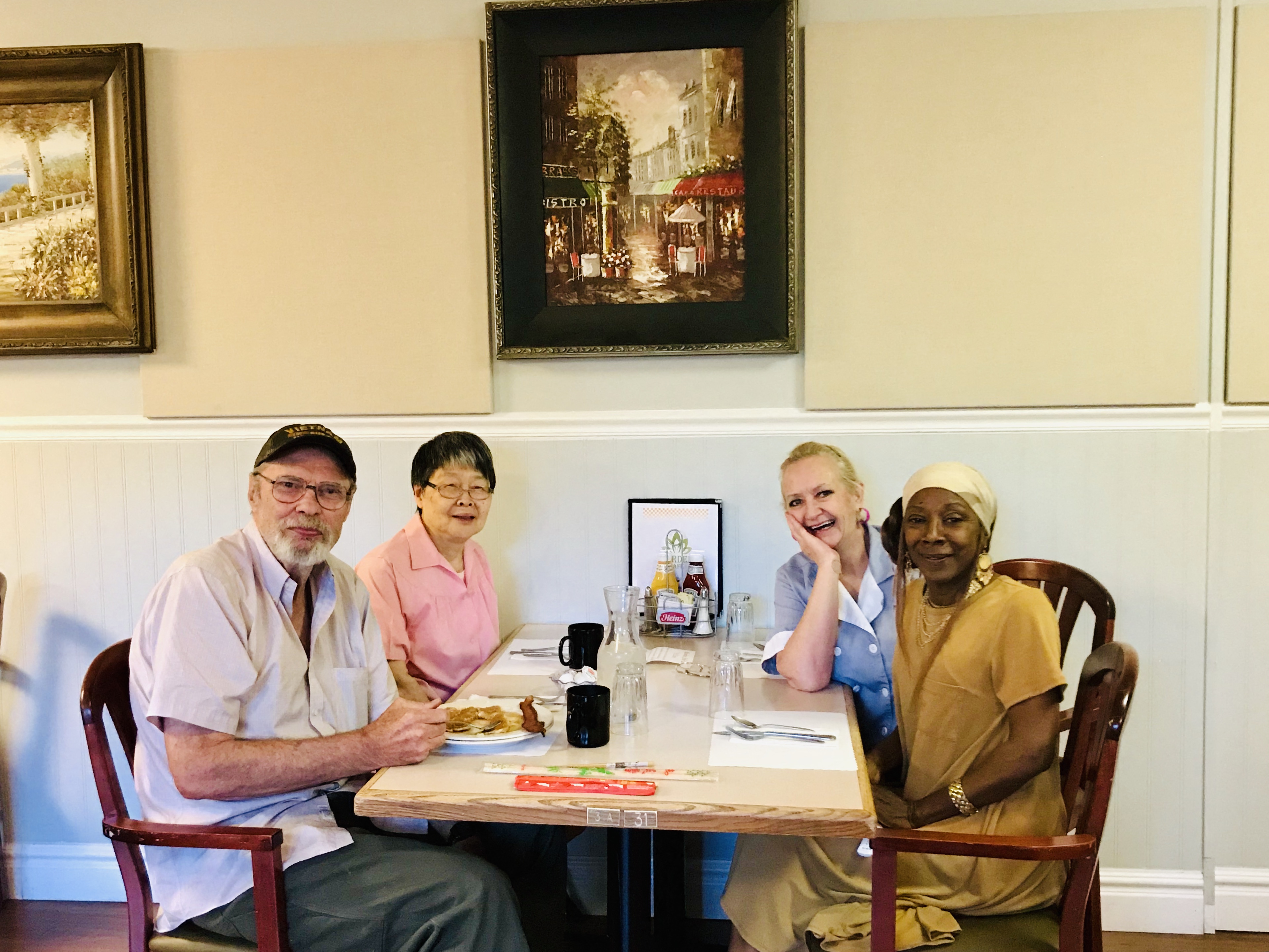 a group of people sitting around a table