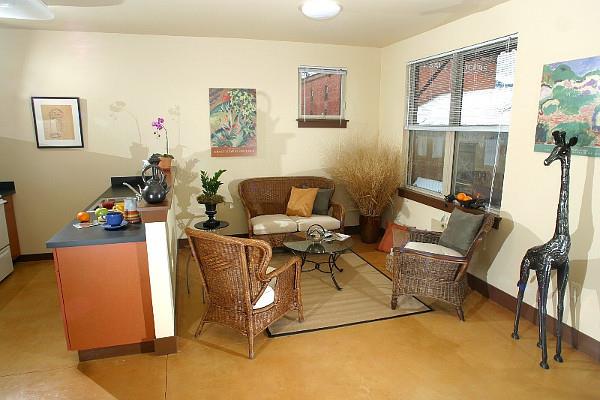 a living room with two chairs and a table