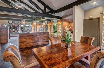 Apartments in Renton WA- Clubhouse With Plush Seating Area, Flatscreen TV, and Modern Finishes