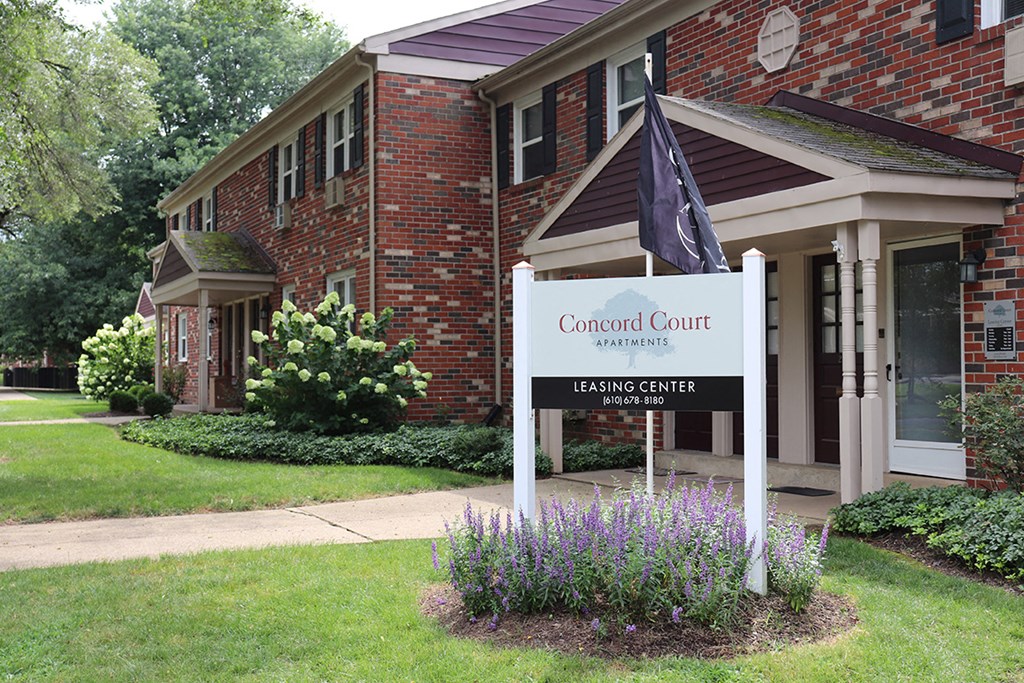 a sign in front of a building