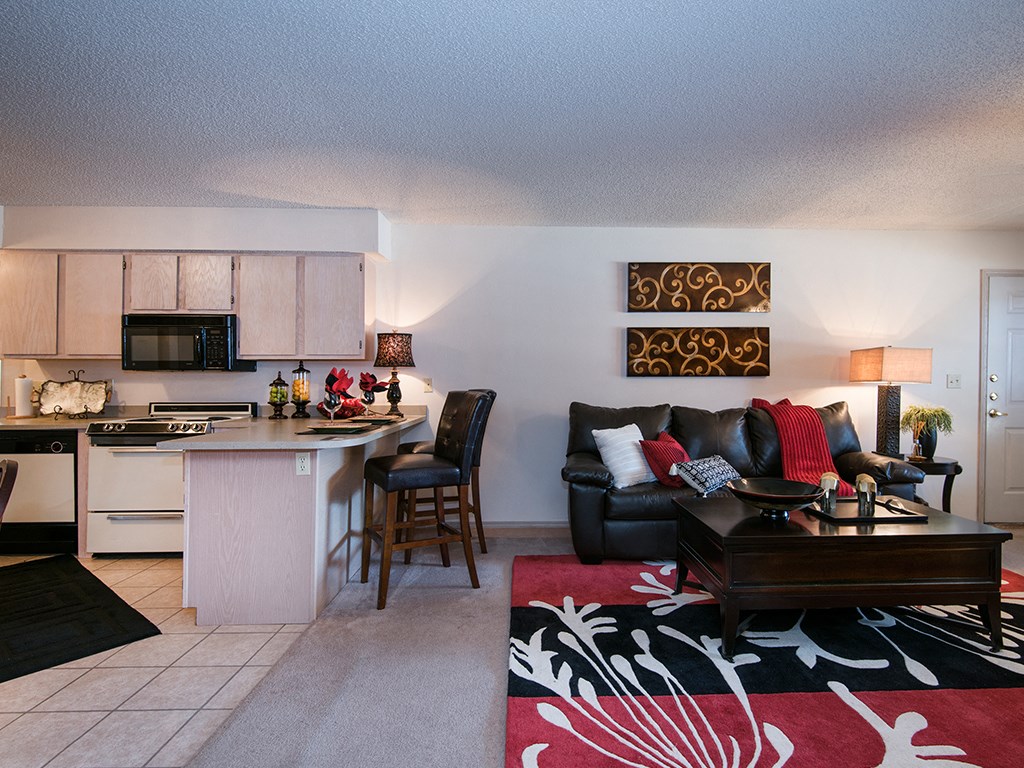 the living room and kitchen of an apartment