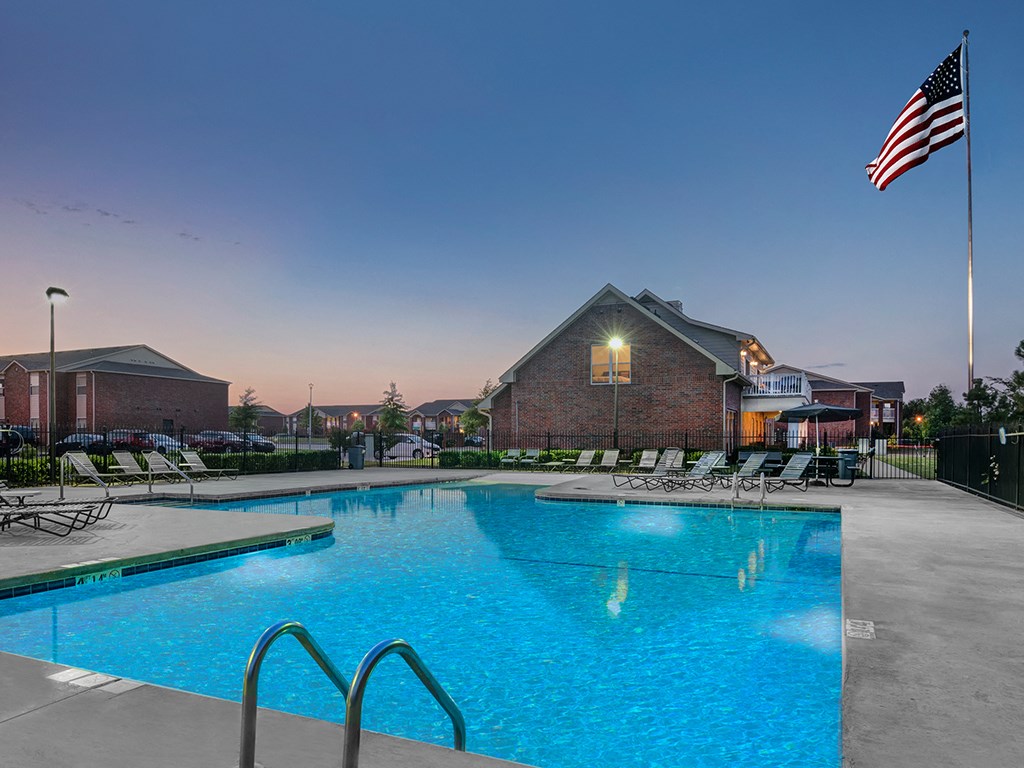 the preserve at ballantyne commons pool and flag at night