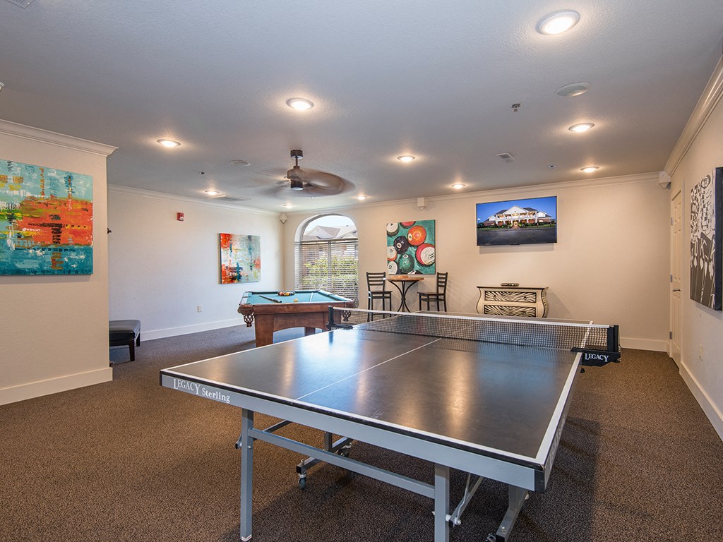 a game room with a ping pong table