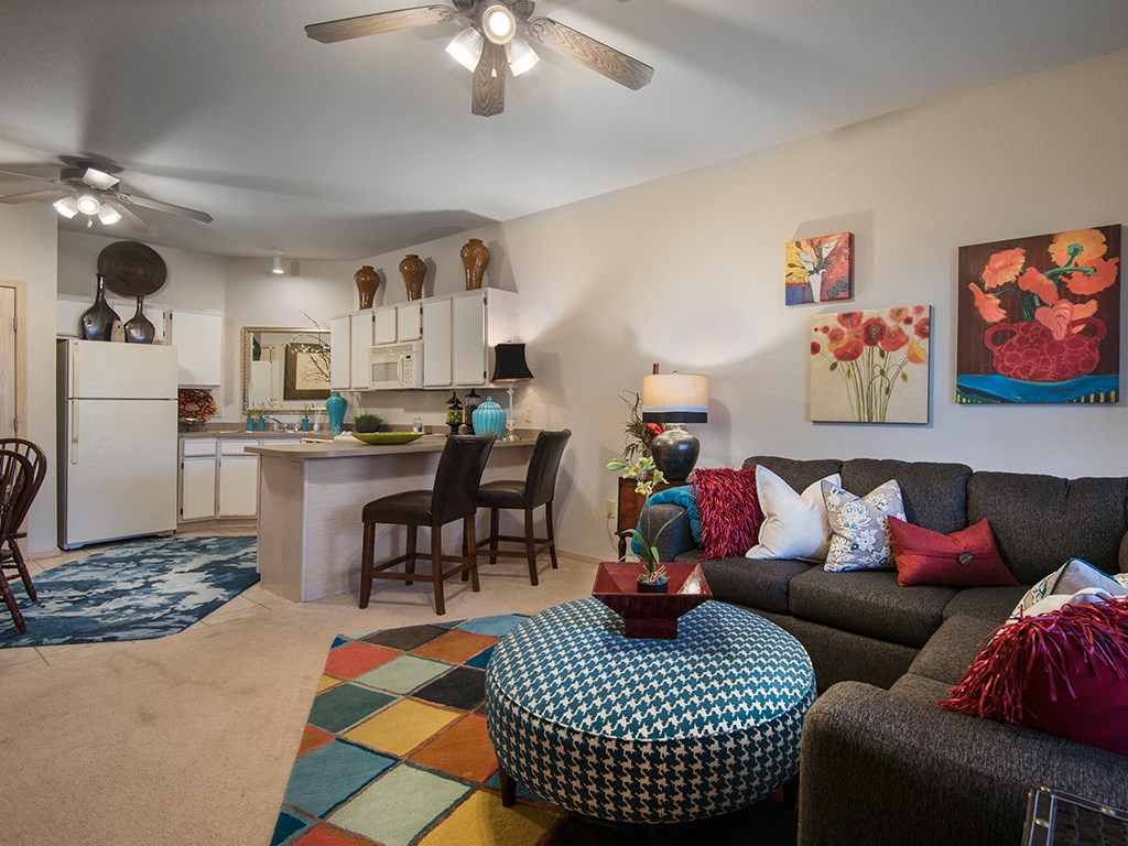 a living room and kitchen with a couch and a