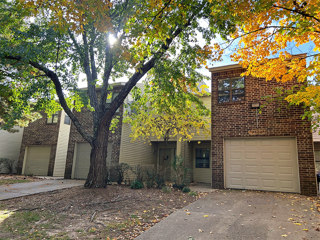 a house with a tree in front of it