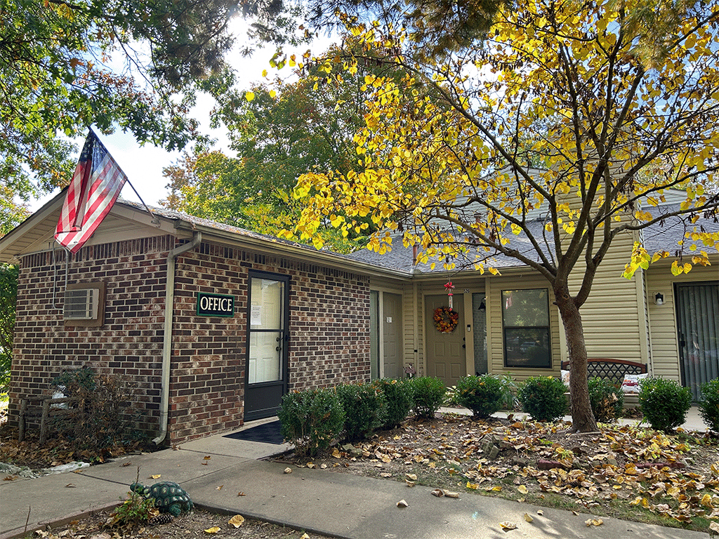 our office is located in a brick building with a flag