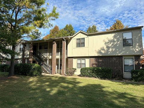 our apartments have a spacious yard with green grass and trees