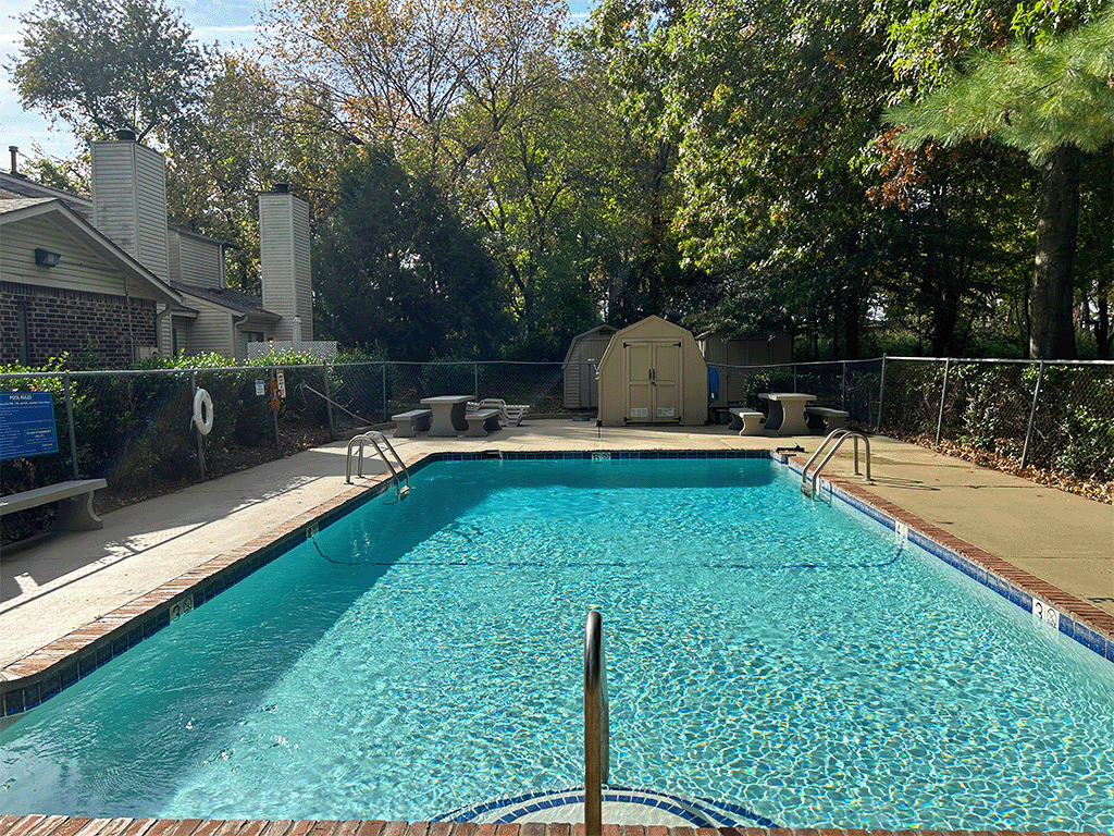 a swimming pool with a fence around it