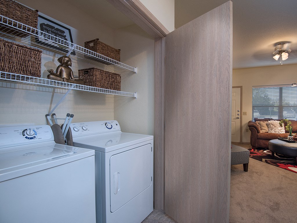 full size washer and dryer in the laundry room of a home