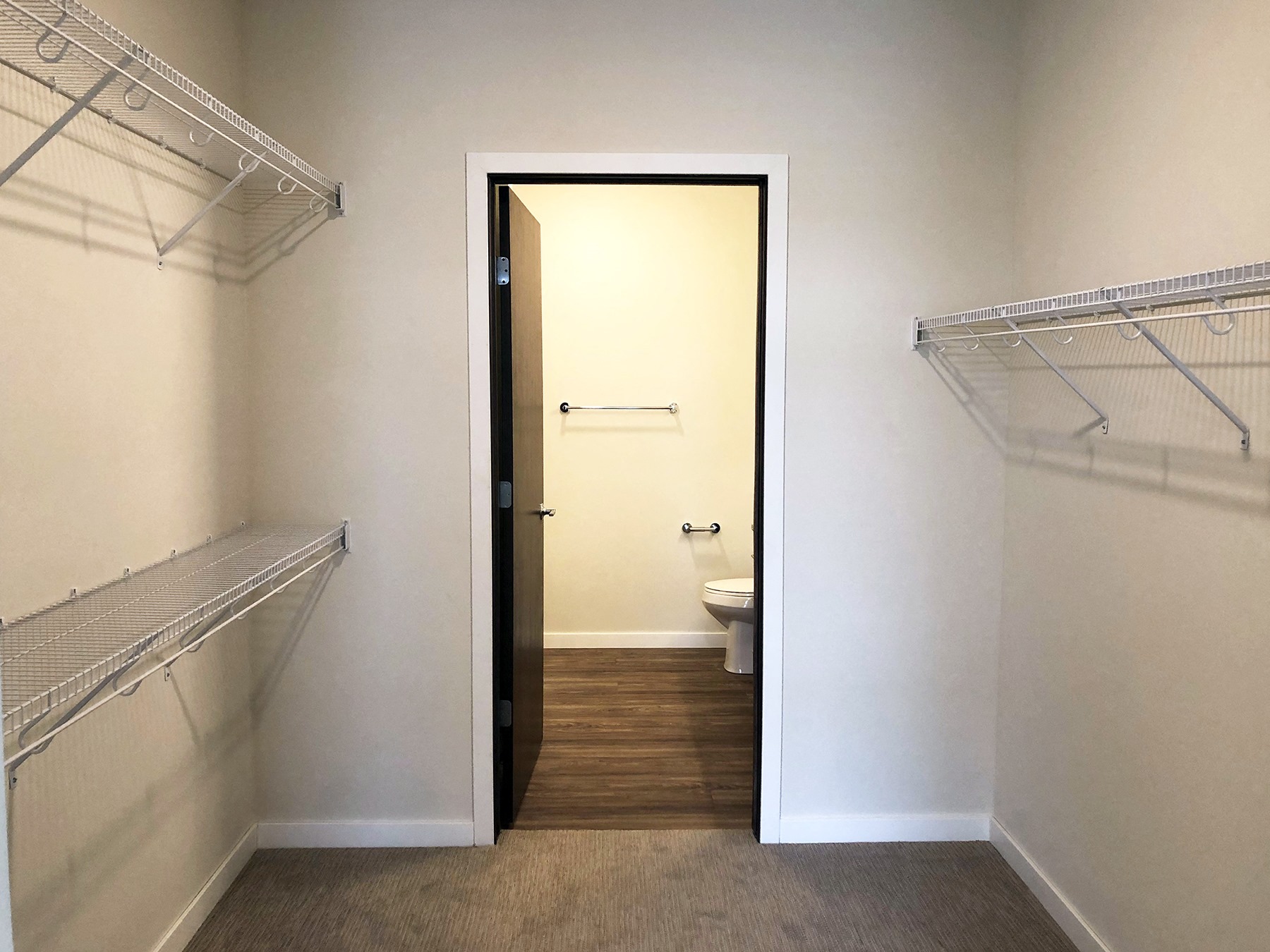 a empty room with a closet and a toilet in it
