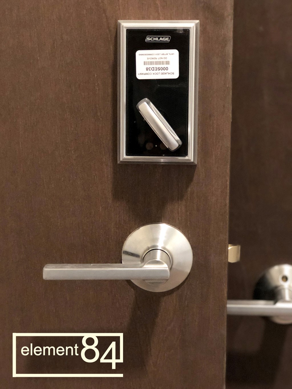 a lock on a door with a code on it and a door handle