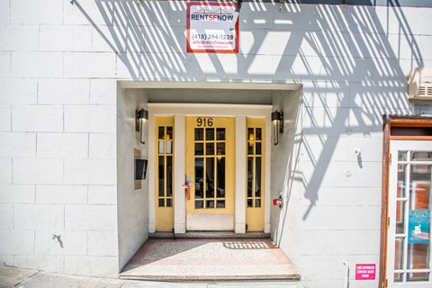 The front door of a building with a sign that says "Rentspow" above it.