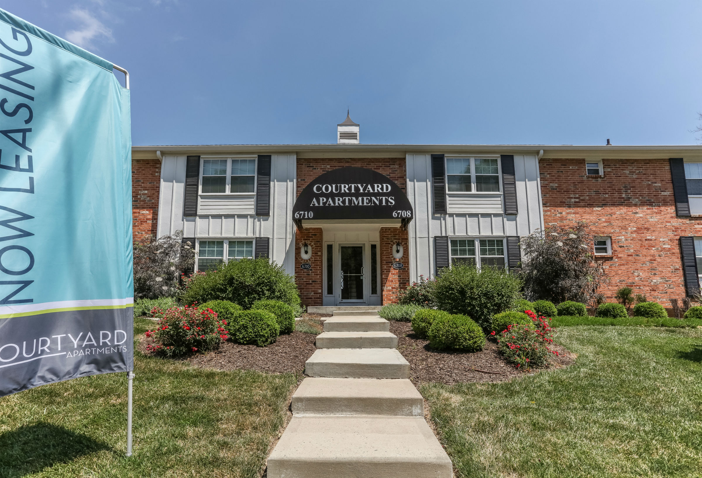 a building with a blue sign in front of it