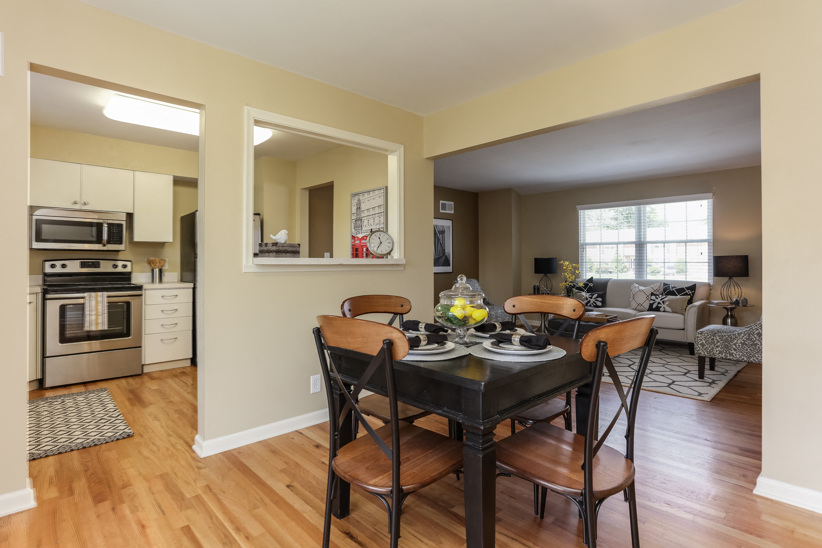 a kitchen and dining room with a table and chairs