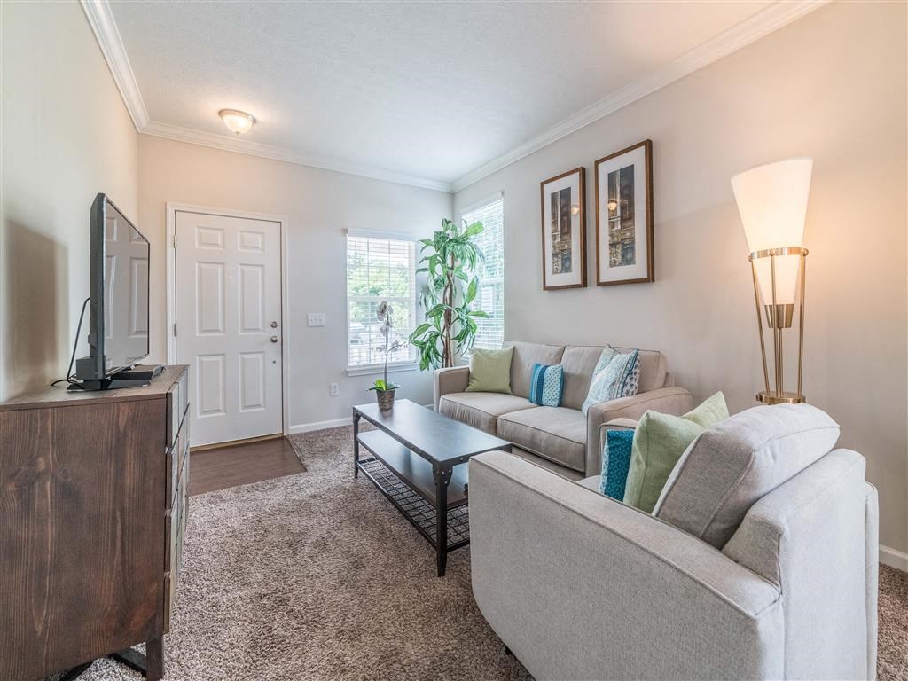 a living room with a couch and a tv