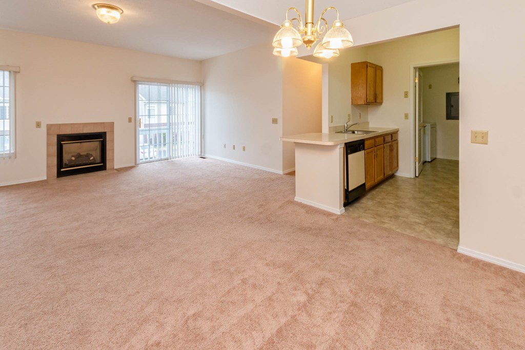 Living Room With Cozy Fireplace at Blueberry Hill Apartments, Rochester, NY