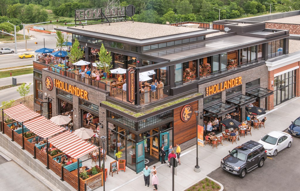 a rendering of a building with people outside of it