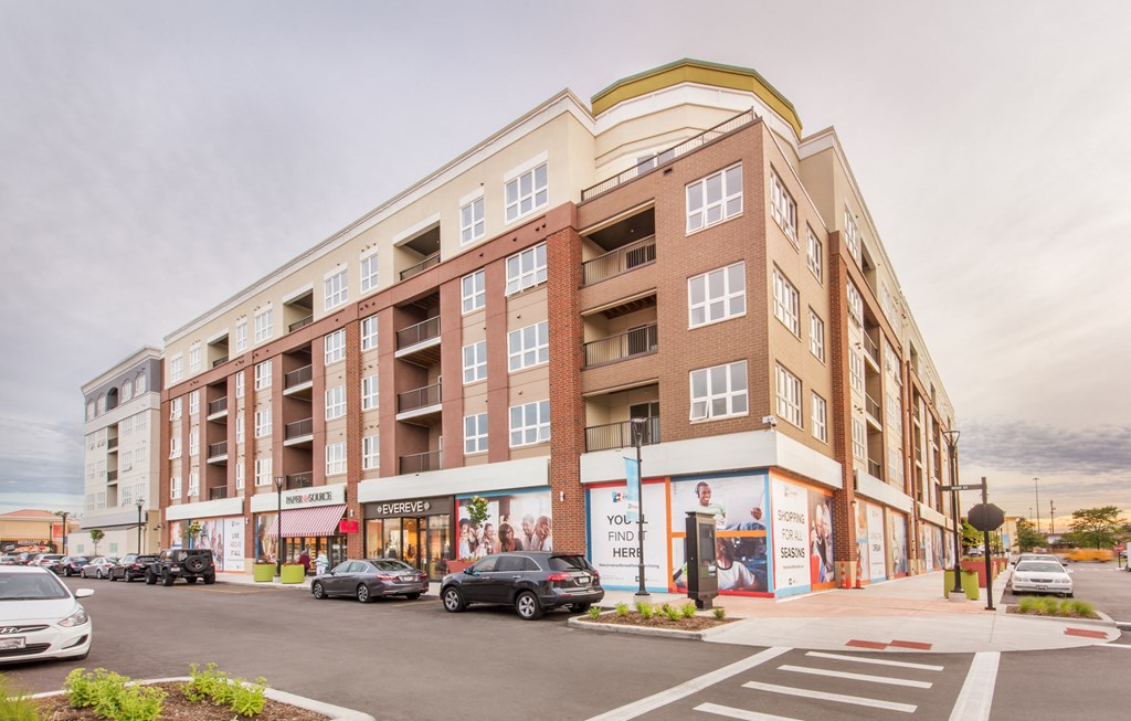 a rendering of an apartment building on a city street