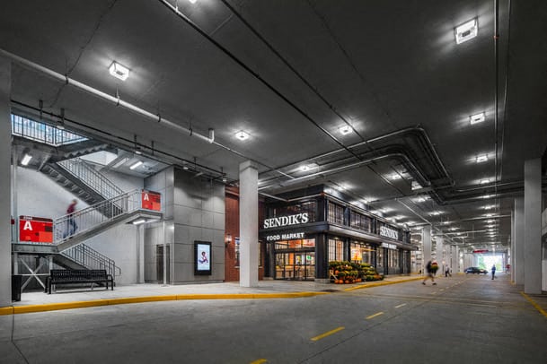 a building in a parking garage at night