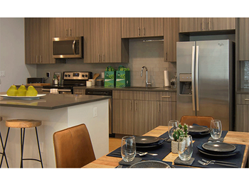 Spacious Kitchen with Pantry Cabinet at Cycle Apartments, Ft. Collins, CO, 80525
