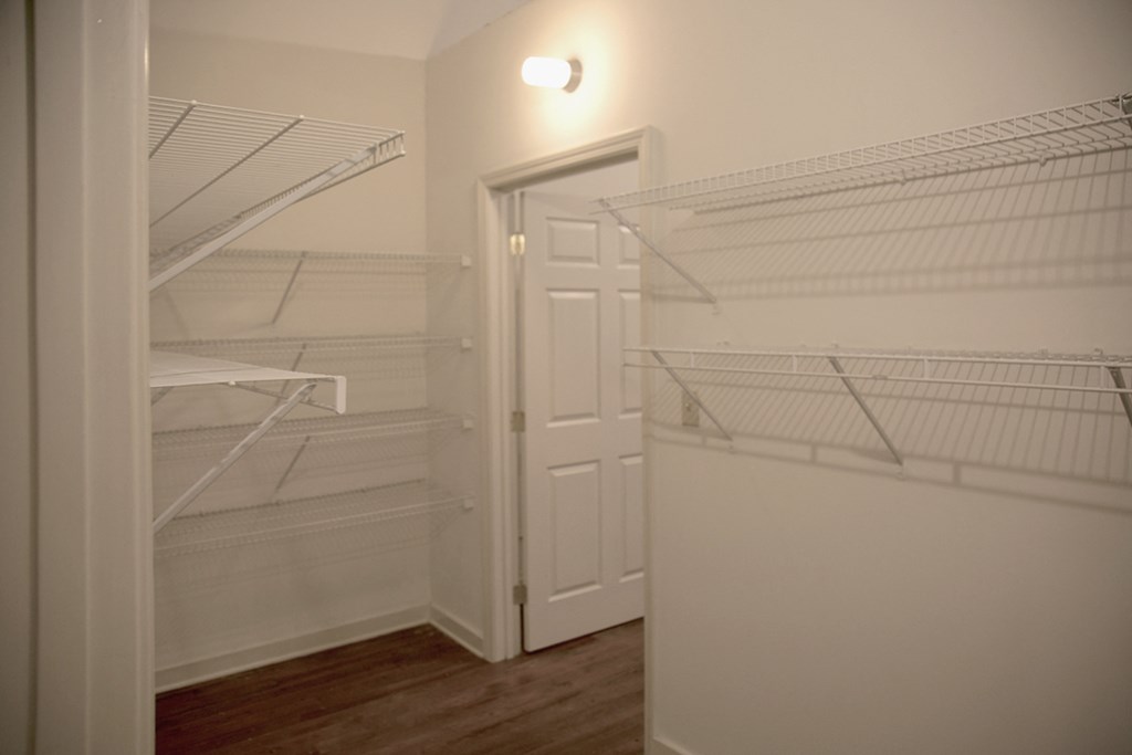 large bedroom closet with built-in wire shelving at Fix Play Lofts, Alabama, 35203