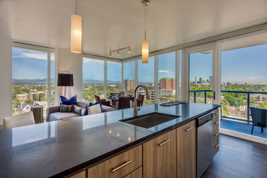 a kitchen and living room with a view of the city