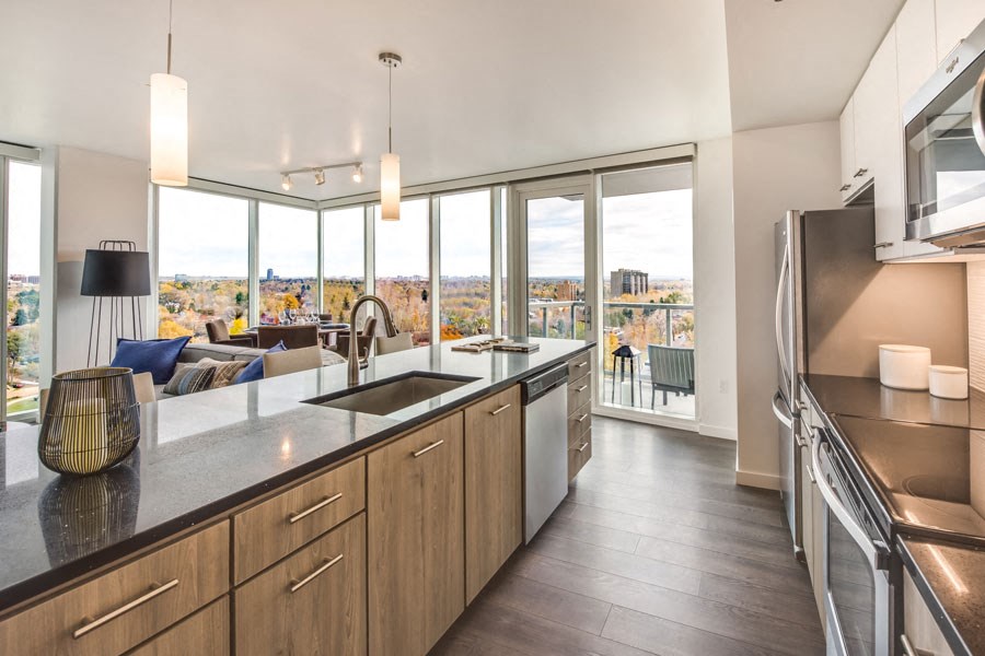 a kitchen with a sink and a large window