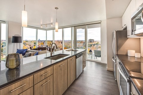 a kitchen with a sink and a large window