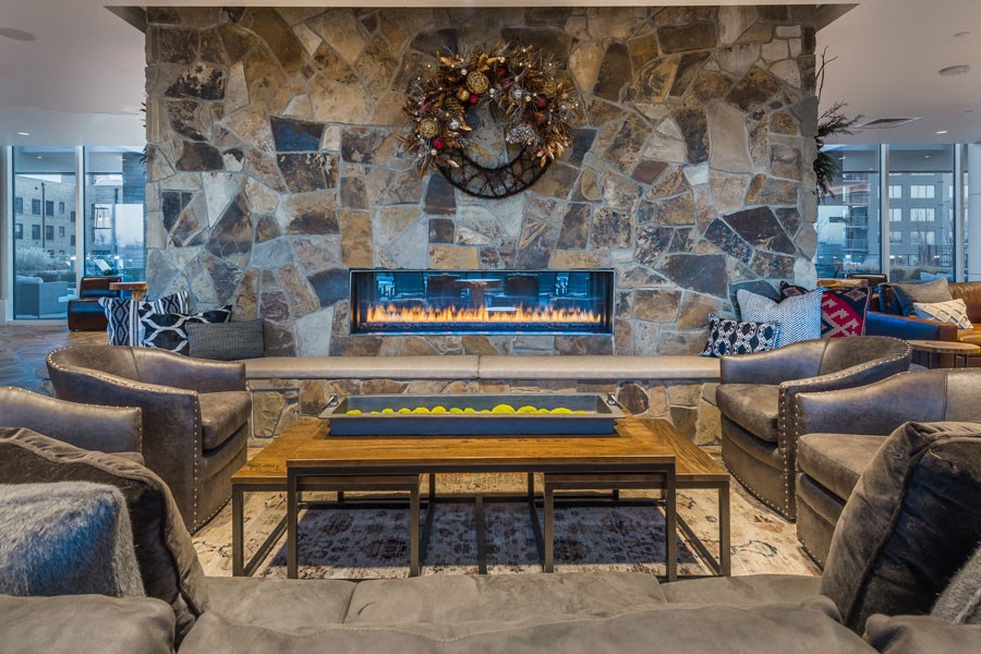 a living room with a fireplace and couches